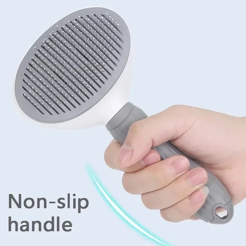 Cat being groomed with deshedding brush